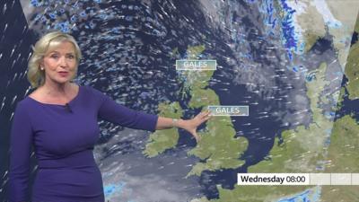 Carol Kirkwood presenting the weather, gale signs are on the map