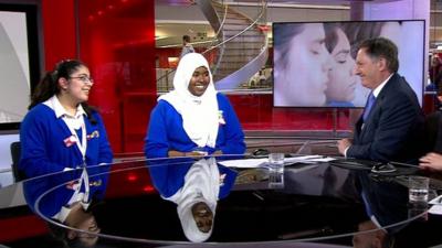 School children in a news studio