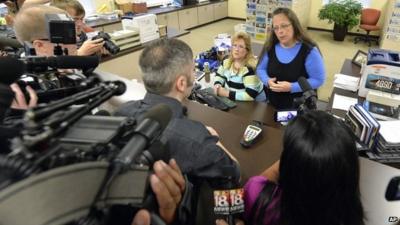 Rowan County Clerk Kim Davis, right, talks with David Moore following her office's refusal to issue marriage licenses at the Rowan County Courthouse