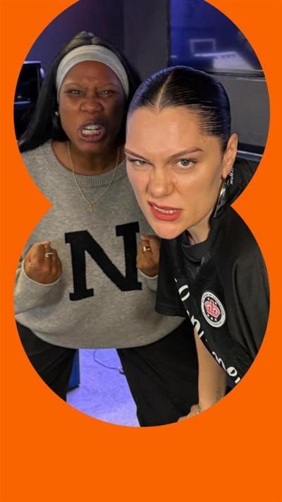 Jessie J and Nadia Jae make faces while crouching in a radio studio