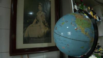 Globe and a picture of the Queen