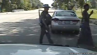 Still from dashcam footage showing a Texas trooper allegedly pointing a taser at Sandra Bland during a traffic stop