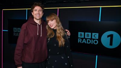 Greg James and Taylor Swift in the Radio 1 studio