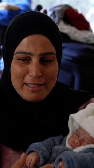 Ghada holds one of her babies