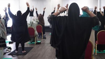 Muslim women exercising