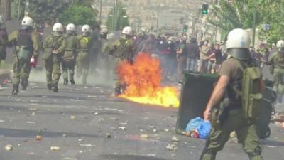 Petrol bombs exploding near police