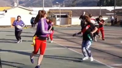 Women playing rugby