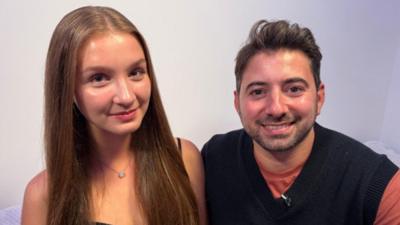 Maryna, a Ukrainian girl living in the UK, smiles with Newsround's Ricky