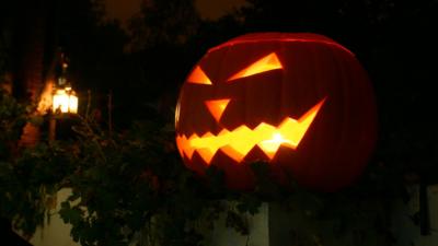 Carved pumpkin lantern in the dark