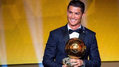 Cristiano Ronaldo receives the 2014 FIFA Ballon d'Or award for the player of the year.