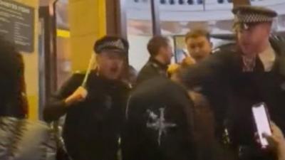 Police officer pushes man outs Brixton Academy