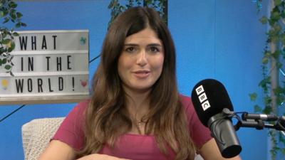 Hannah in the What in the World studio speaking