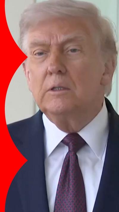 Donald Trump wearing dark navy blue suit and dark purple tie