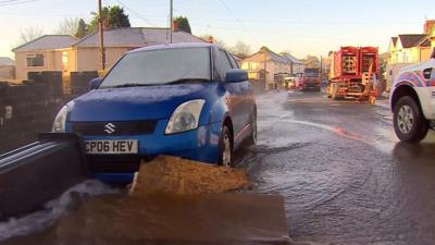 Cars stuck in flood water in Skewen