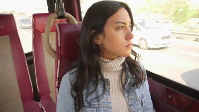 Asena boards a minibus for the first time since the attack.