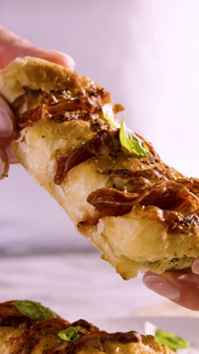 A stick of garlic bread with filling