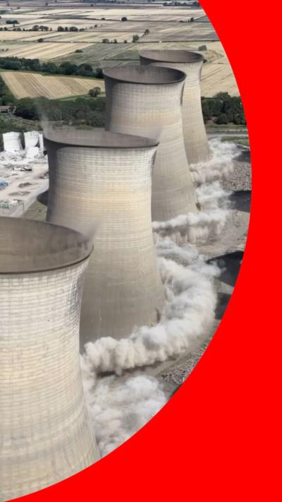 Cooling towers mid-collapse