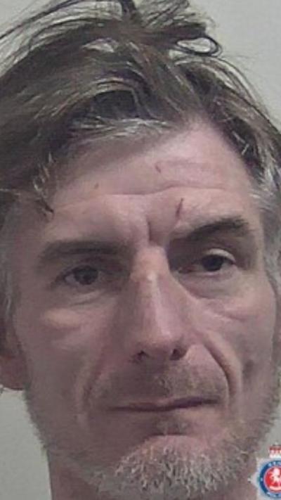 A mugshot of Karl Kayner.