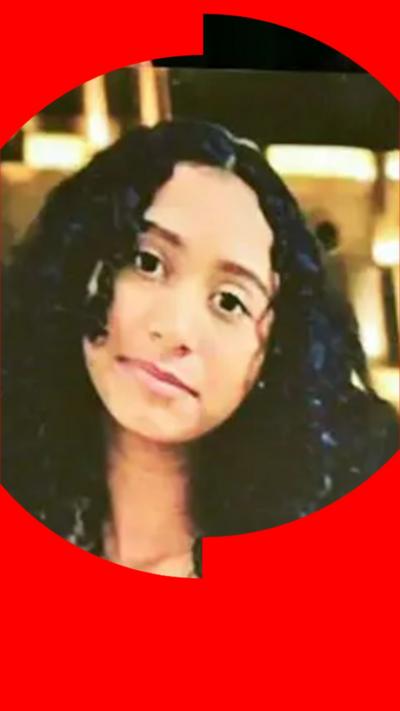 A portrait of the late Celeste Rivas Hernandez is shown during a press briefing by Los Angeles County District.