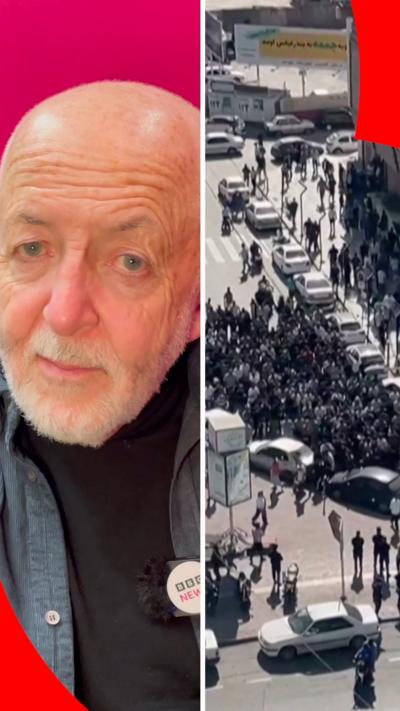 A split screen image. On the left, Jeremy Bowen in front of a pink background. On the left, a still image of a protest in Iran.