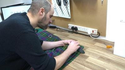 A kilt being made by hand