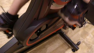 A person on an exercise bike