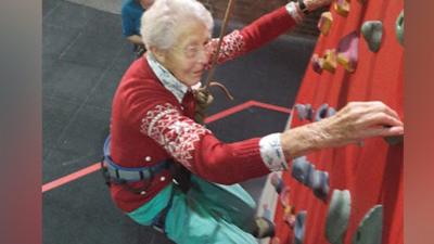 Greta on a climbing wall