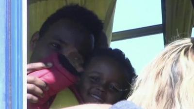 Migrant boy survivor arrives in Greece after sea rescue