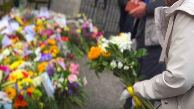 People laying flowers at Balmoral Castle