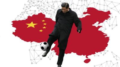 China's President Xi Jinping kicking a ball