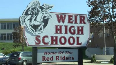 A sign for Weir High School