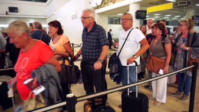 Queues at an airport in The Gambia