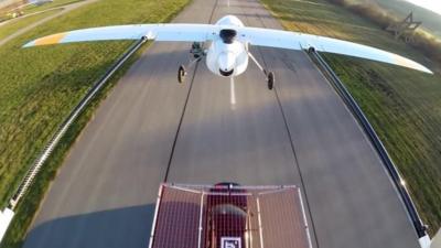 Drone preparing to land on a car.