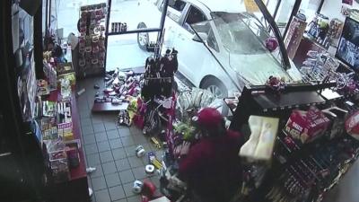 car smashes through shop window