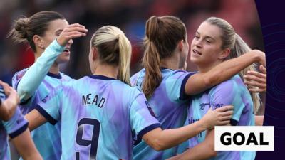 Arsenal players celebrate Russo's goal