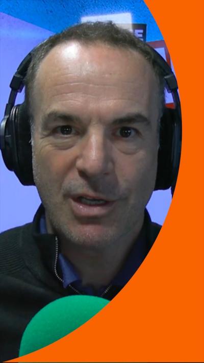 Martin Lewis, a man with over-ear headphones on and a green microphone.