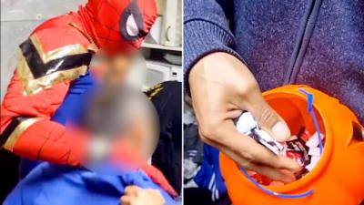 A composite image of a man dressed as Spiderman holding two suspects in blue on the left and on the right is a plastic pumpkin filled with white and black packets.