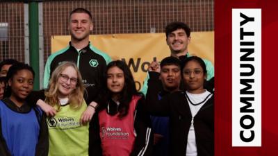 Wolves' Sam Johnstone and Rodrigo Gomes with local schoolkids