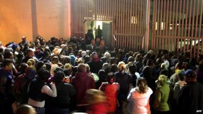 Relatives of inmates gather outside the Topo Chico prison in the northern city of Monterrey in Mexico