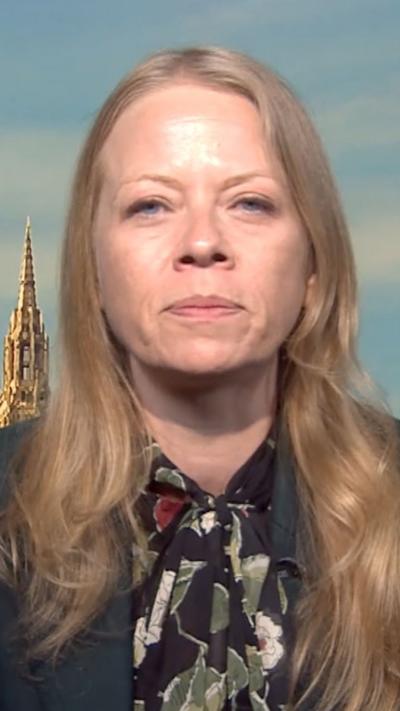 Sian Berry MP in a studio wearing a floral shirt