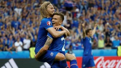 Arnor Ingvi Traustason celebrates with Birkir Bjarnason after scoring the second goal