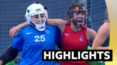 Two Great Britain women's hockey players smiling after beating Ireland