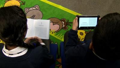 Children reading books and e-books