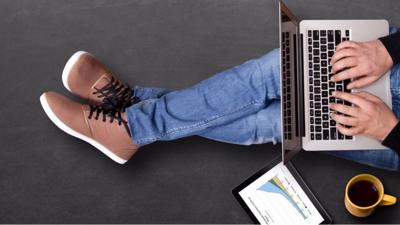 Man sitting working on a laptop