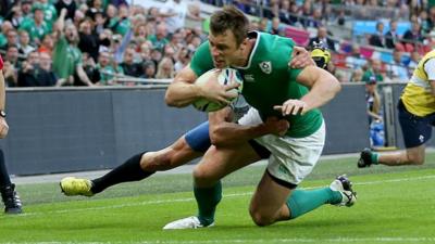 Tommy Bowe scores a try against Romania