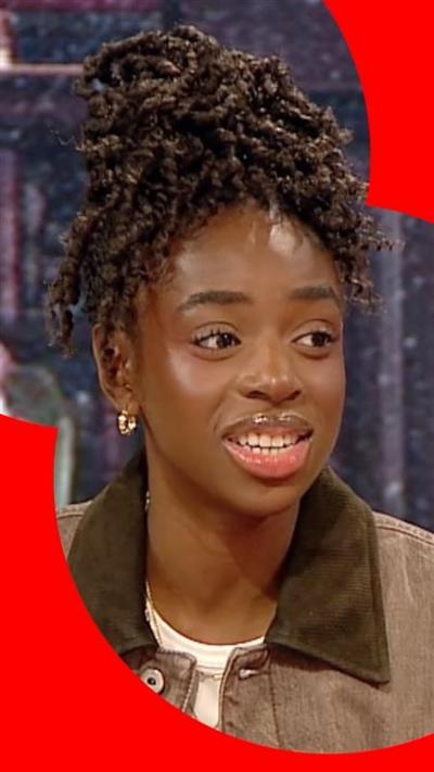 Singer and Celebrity Traitors finalist Cat Burns wearing brown jacket 