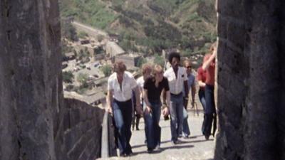 The West Brom team climbing steps on the Great Wall of China.