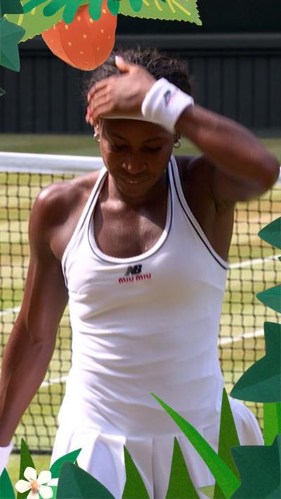 Coco Gauff places hand to her head 