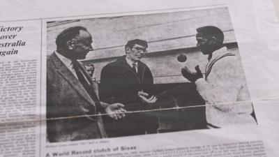 Sir Garfield Sobers collects the match ball after hitting six sixes in one over against Glamorgan at St Helen's