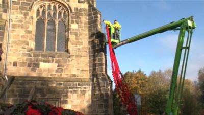 Poppies being fixed to church